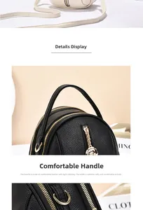 Detail of black lychee grain leather mini backpack with gold rose-shaped zippers