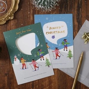Handmade hollow 3D Christmas greeting cards with blue and green festive designs on wood
