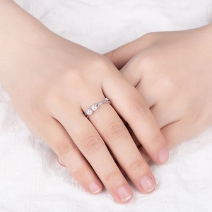 Double-layered twist silver ring with two white pearls and sparkling pavé zircons