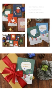 Detailed view of vintage hollow 3D Christmas cards with snowman and tree patterns on wood