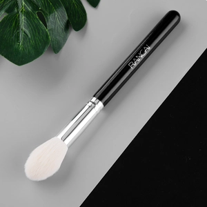 Angled contour makeup brush with white soft bristles and black handle for highlighting