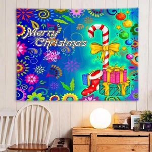 Detail of blue Christmas tapestry featuring festive gifts and Merry Christmas lettering