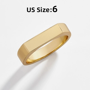 Detail of a vintage golden rectangular ring with a smooth finish and US size 6 label