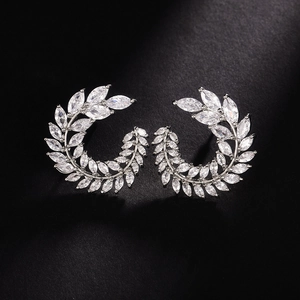 Close-up of elegant leaf-shaped earrings featuring marquise-cut sparkling cubic zirconia