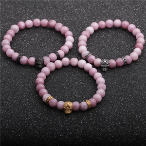 Three-piece set of 8mm agate stone bead bracelets with gold, silver and black skull charms