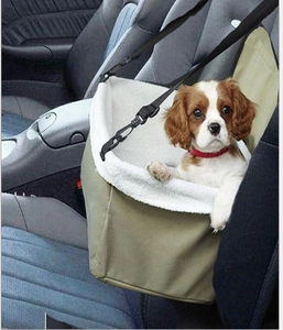 Breathable olive green car booster seat for dogs with white plush lining and headrest straps