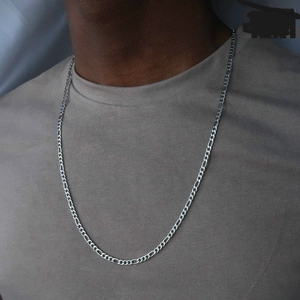 Men's silver Figaro chain necklace long hip-hop style pendant worn on a model's neck
