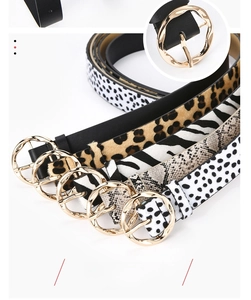 Detail of five assorted fashion belts featuring leopard, zebra, and snake skin patterns