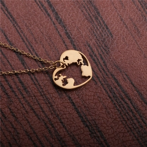 Golden titanium steel necklace featuring a hollow heart-shaped world map pendant