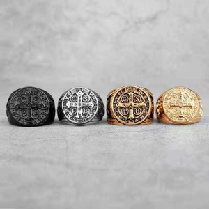 Detailed comparison of vintage religious cross rings in black silver and gold steel finishes