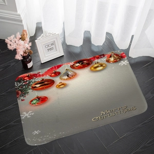 Detail of Christmas flannel floor mat featuring golden Merry Christmas text on wood floor