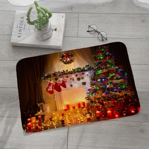 Detailed top view of Christmas flannel mat with tree and fireplace design on wood floor