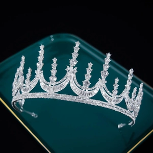 Elegant bridal rhinestone tiara on green tray for wedding ceremonies and banquets