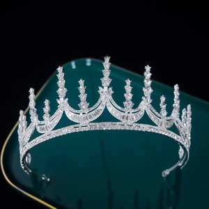 Macro shot of shimmering silver bridal crown with intricate rhinestone inlay and detail
