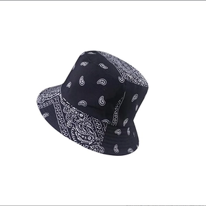 Navy blue paisley bucket hat with white pattern for sun protection in classic cotton canvas
