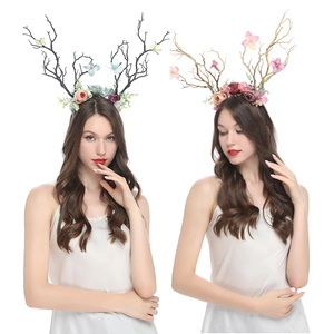 Detailed view of reindeer antler headbands with colorful velvet flowers and floral accents