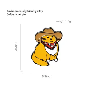 Cute ginger cat enamel pin wearing a brown cowboy hat and red scarf badge