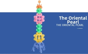 Tall tower model made of large colorful snowflake building blocks for creative play