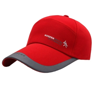 Red sports baseball cap with long visor and Modern British print in a side view
