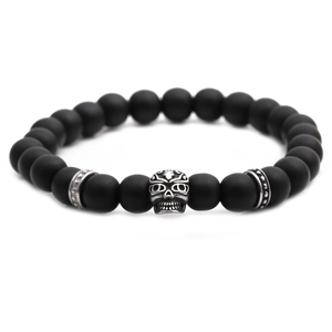 Men's gothic 8mm matte black stone bead bracelet with a silver skull charm focal point