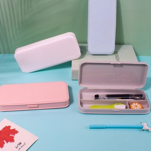 Detailed view of macaron-colored plastic stationery storage boxes with internal compartments