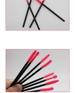 Detail of pink silicone mascara brushes with black handles and ball-tip design