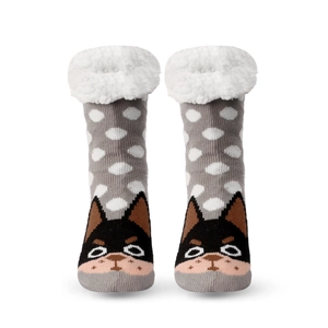 Detail of gray knitted Christmas slipper socks with white polka dots and plush dog face