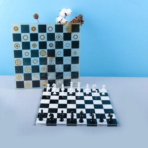 Macro detail of glossy chess pieces and board mold set with industrial gear accents