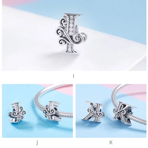 Macro detail of S925 sterling silver letter beads I J K with zircon stones for bracelets