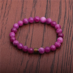 8mm purple mood bead bracelet on a leather background with thermal color changing beads