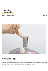 Detail of gray plush unicorn travel pillow hook and white horn decorative element