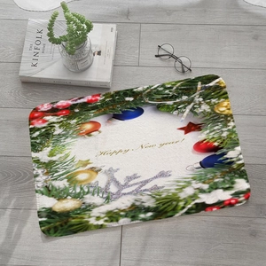 Detailed close-up of festive flannel door mat with Happy New Year pine and berry design