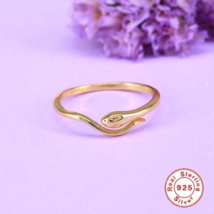 Macro shot of S925 sterling silver hallmark on the inner band of the gold snake ring