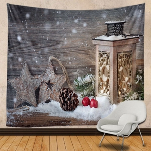 Christmas tapestry with vintage lantern and pine cones hanging on a bedroom wall