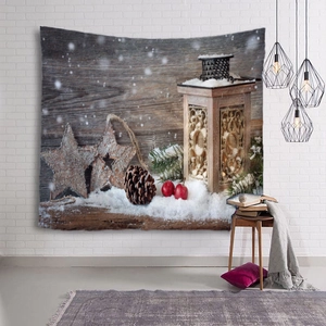 Detailed view of Christmas wall tapestry featuring a cozy winter scene on a white brick wall