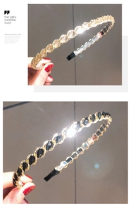 Close-up of twisted metal chain headband with crystal and black stone inlay detail
