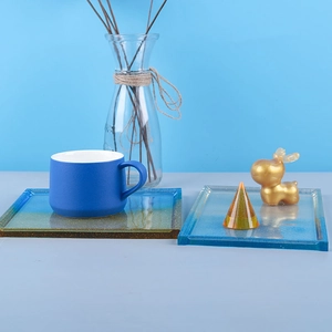 Detail of blue and gold resin coaster molds with glitter edges for DIY resin casting