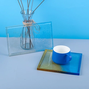 Detail of rectangular resin coaster molds with glitter gradient finish and liquid texture
