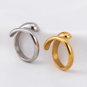 Minimalist stainless steel teardrop open rings in gold and silver finish on white fabric