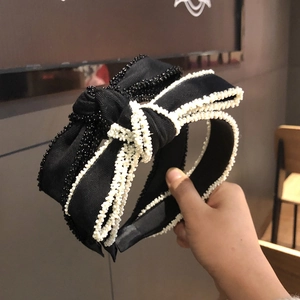 Cerchietti eleganti con fiocco e finiture di perle in tessuto nero per accessori moda
