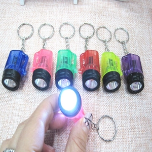 Mini LED flashlight keychains in six assorted colors with transparent plastic shell and keychain
