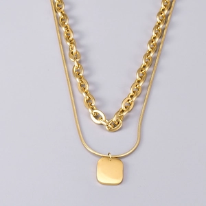 Minimalist double-layer golden stainless steel necklace with a polished square pendant