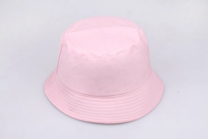 Close-up of pink cotton bucket hat showing detailed fabric texture and fine stitching