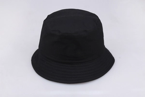 Close-up of black cotton fisherman bucket hat with subtle embossed design for outdoor sun protection
