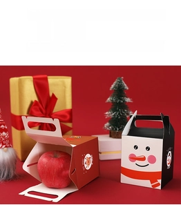 Close-up of snowman and reindeer Christmas gift boxes made of high-quality white cardstock