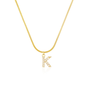 Detailed shot of golden snake chain necklace with a crystal-studded letter K pendant