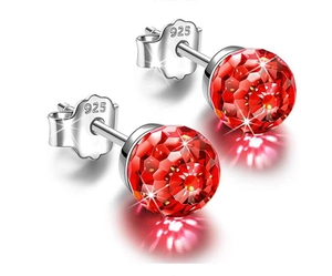 Macro detail of red faceted crystal ball earrings with S925 sterling silver butterfly backs