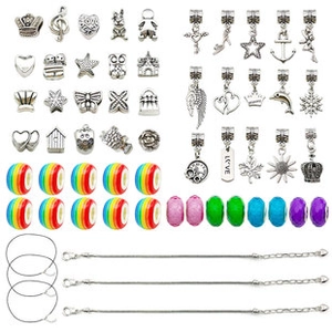 Flat lay of DIY charm bracelet kit with silver pendants, rainbow beads and snake chains