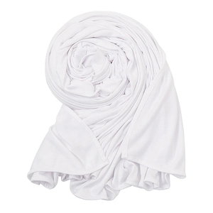 Detail view of the soft white jersey knit fabric texture and premium stitched edges