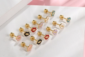 Macro view of multi-colored lip-shaped stud earrings in gold-plated stainless steel
